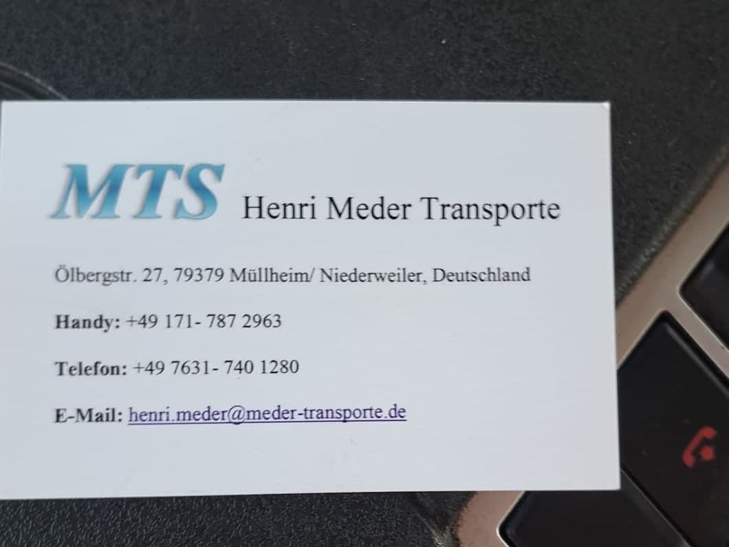Visitenkarte von MTS Henri Meder Transporte auf der Mittelkonsole des Transporters